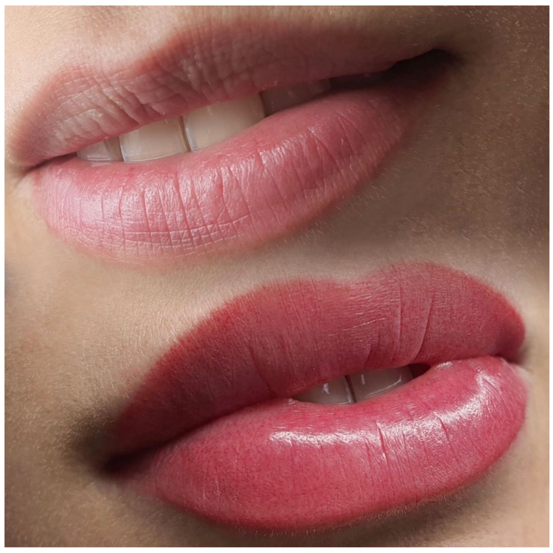 A close up of a woman 's lips with pink lipstick