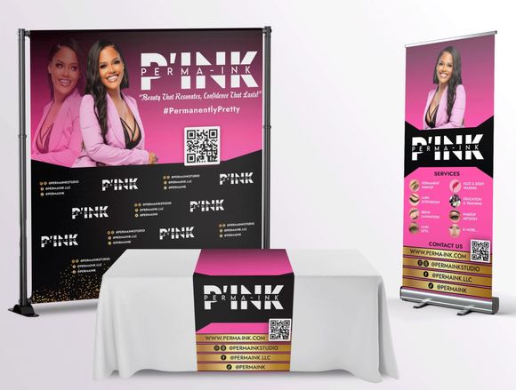 A table with a pink table cloth and a pink banner for pink marketing