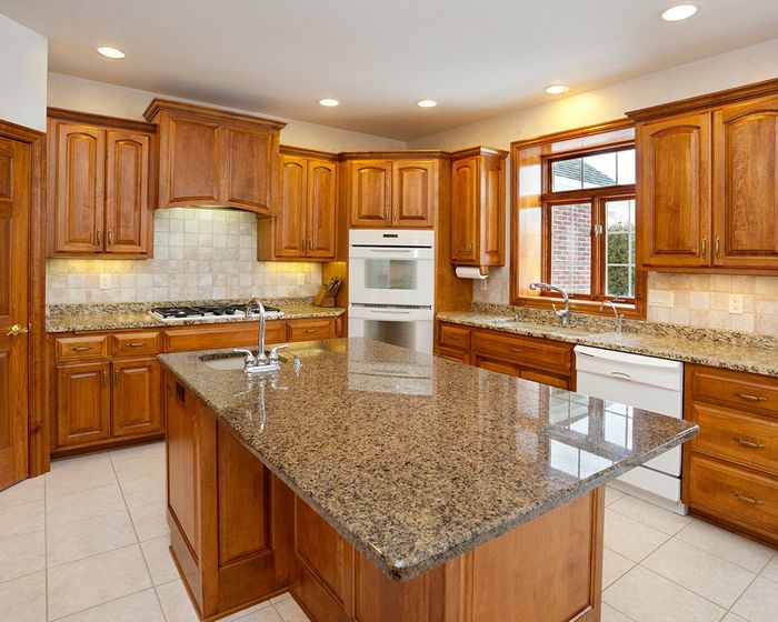 Kitchen with Granite Counters and Hardwood Cabinetry — Neenah, WI — CNK Cabinetry, LLC