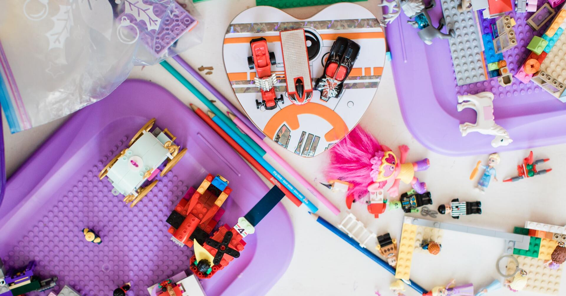 There are many different types of lego toys on the table.