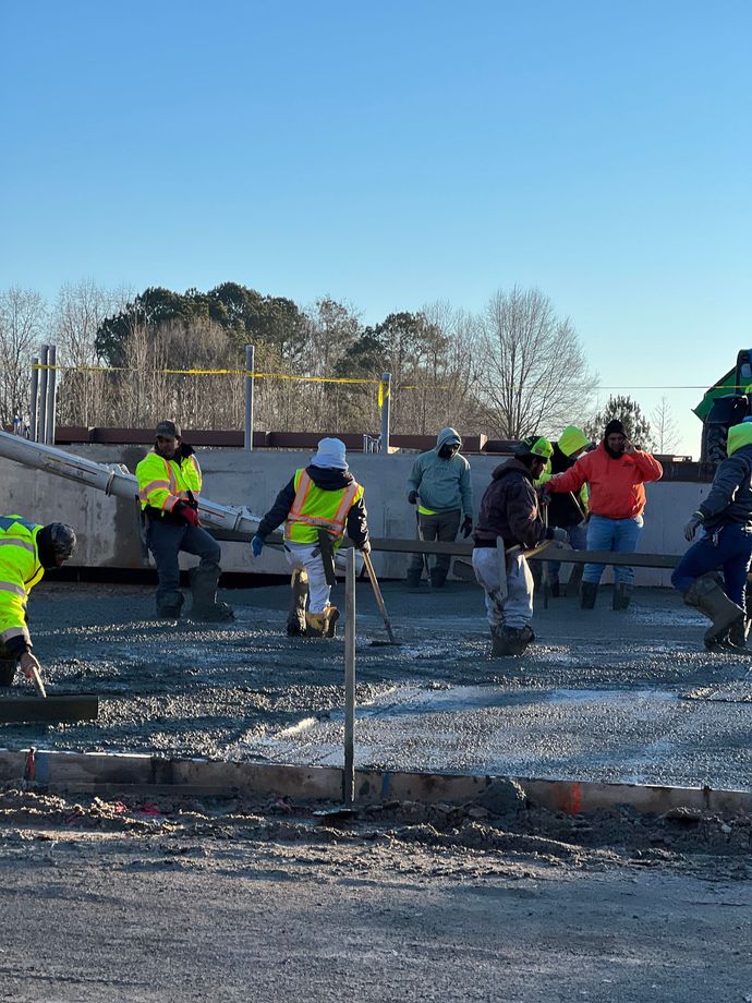 A group of construction workers are working on a construction site