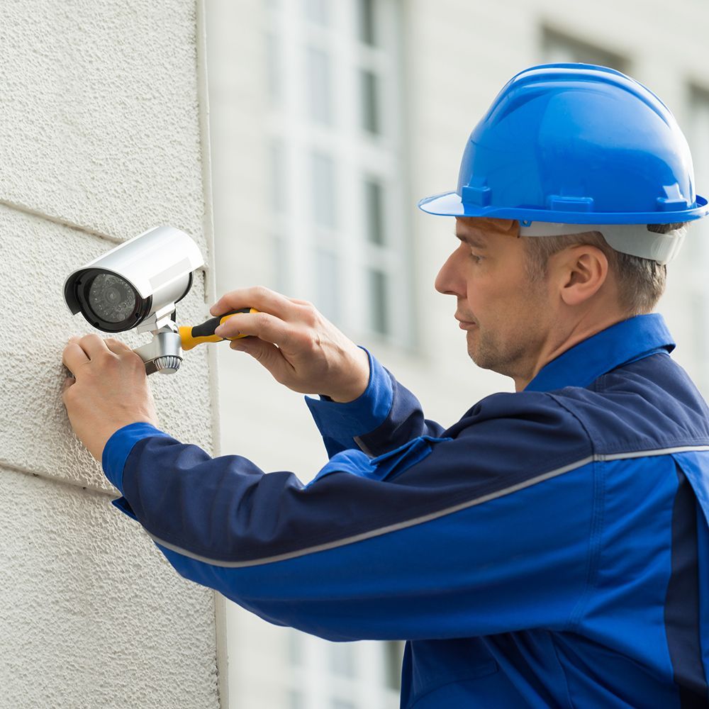Worker Fixing The Camera Wiring
