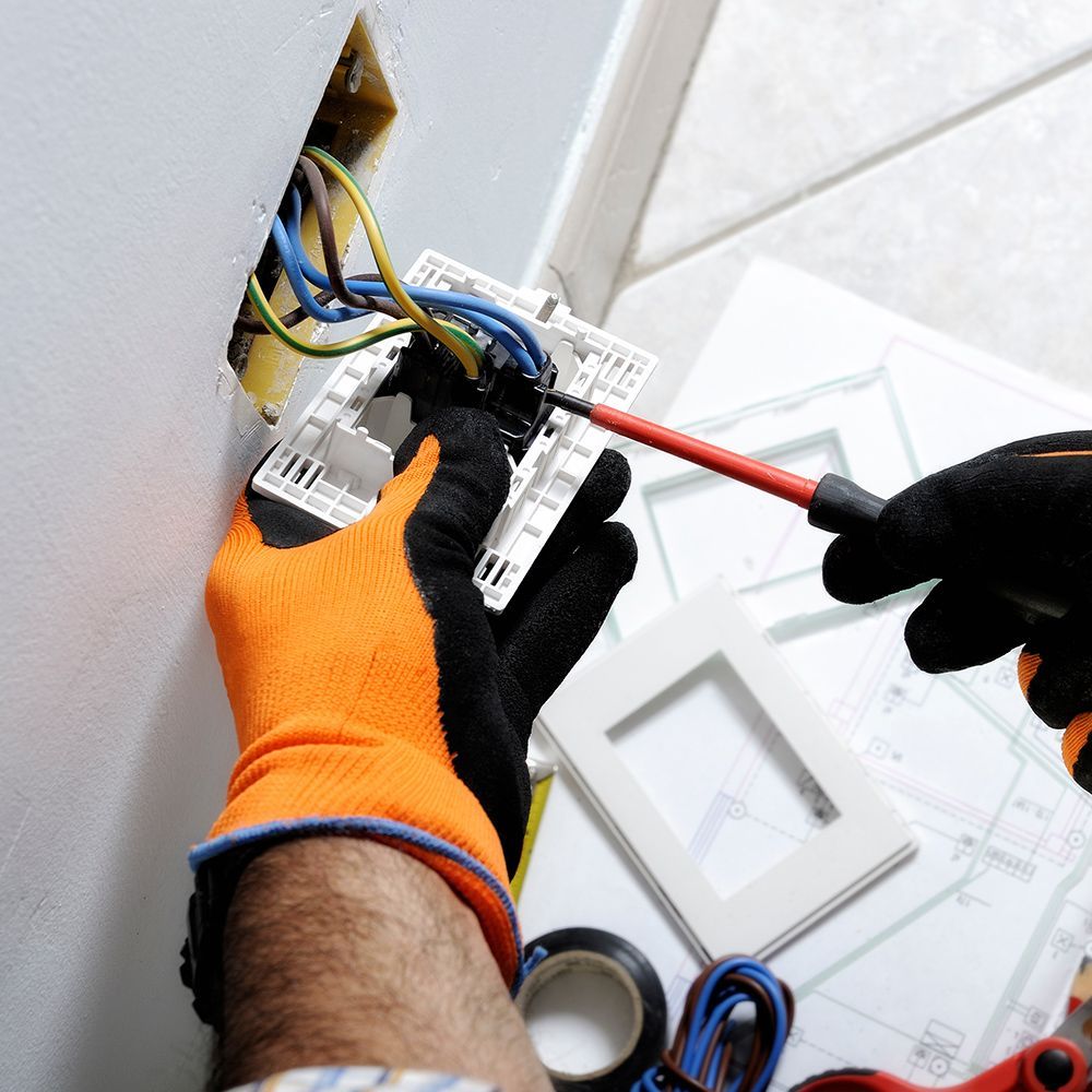 Person Fixing The Outlet