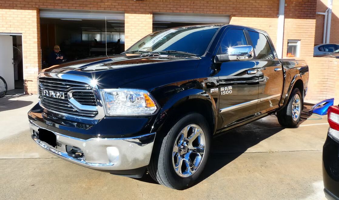 Black Ram 1500 Pickup Truck Parked in Front of a Brick Building — Moto Bodyworks in Fyshwick, ACT