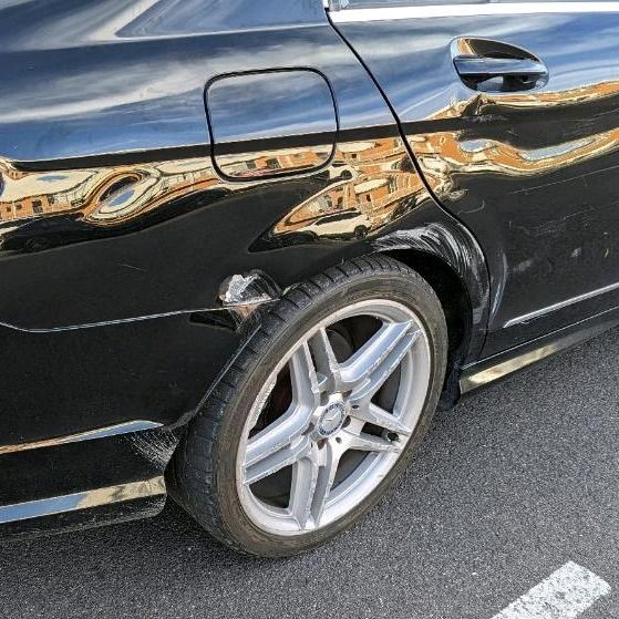 Black Car's Rear Quarter Panel With Silver Wheel — Moto Bodyworks in Fyshwick, ACT