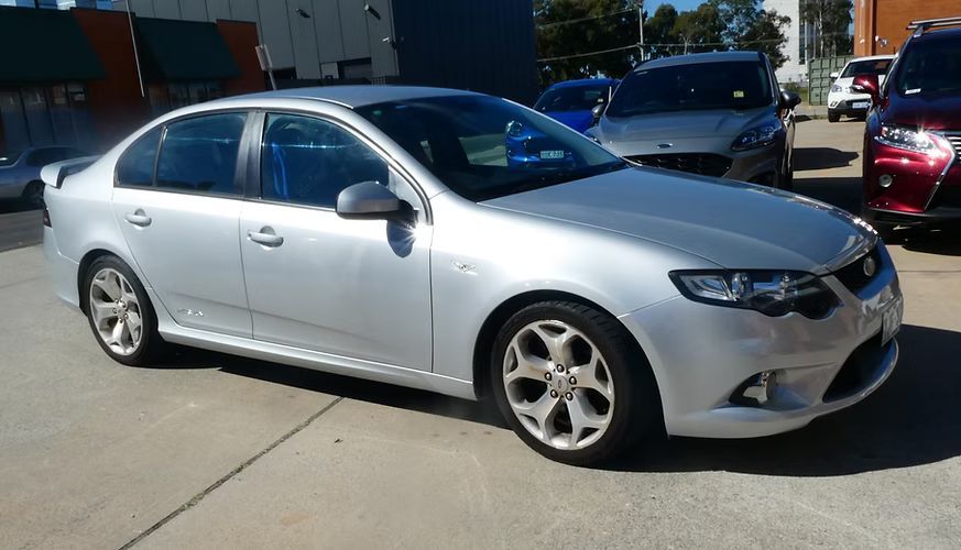 Silver Car Parked Outside in a Car Lot, Under a Bright Sunny Sky — Moto Bodyworks in Fyshwick, ACT