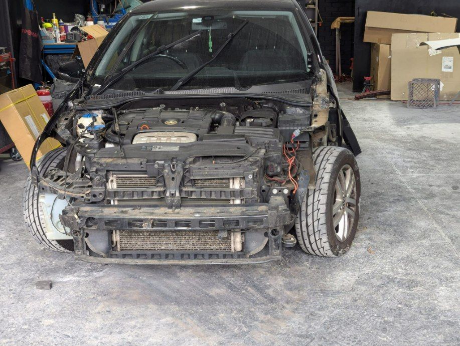 A Black Car With the Front End Removed is in a Garage — Moto Bodyworks in Fyshwick, ACT