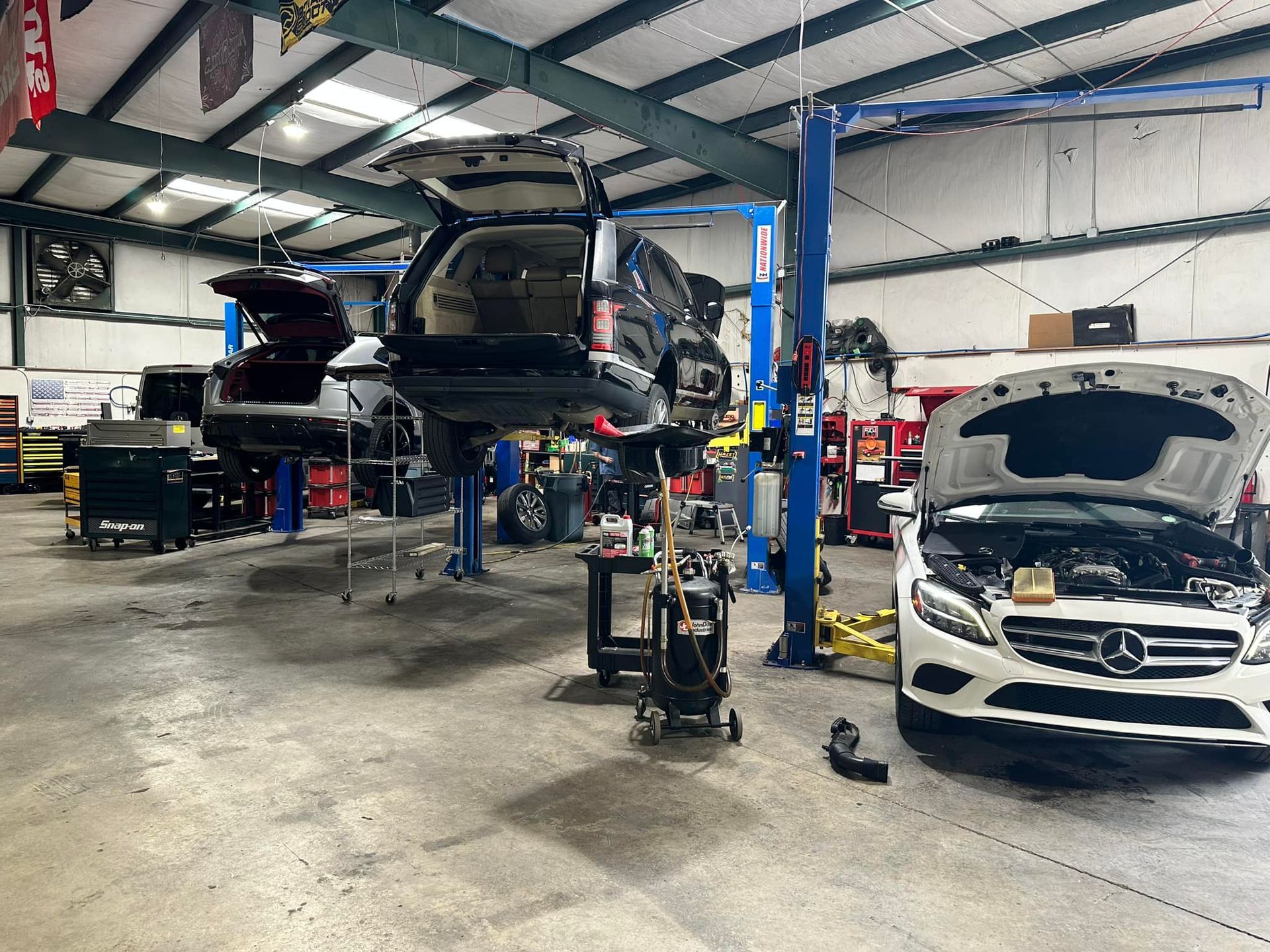 European Vehicles Raised On Lifts During Diagnostic Service | UAC