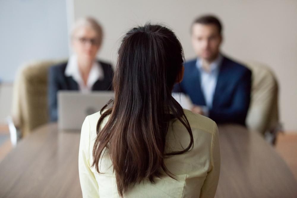 Woman is Sitting at a Table During a Job Interview — Bee HR in Narara, NSW
