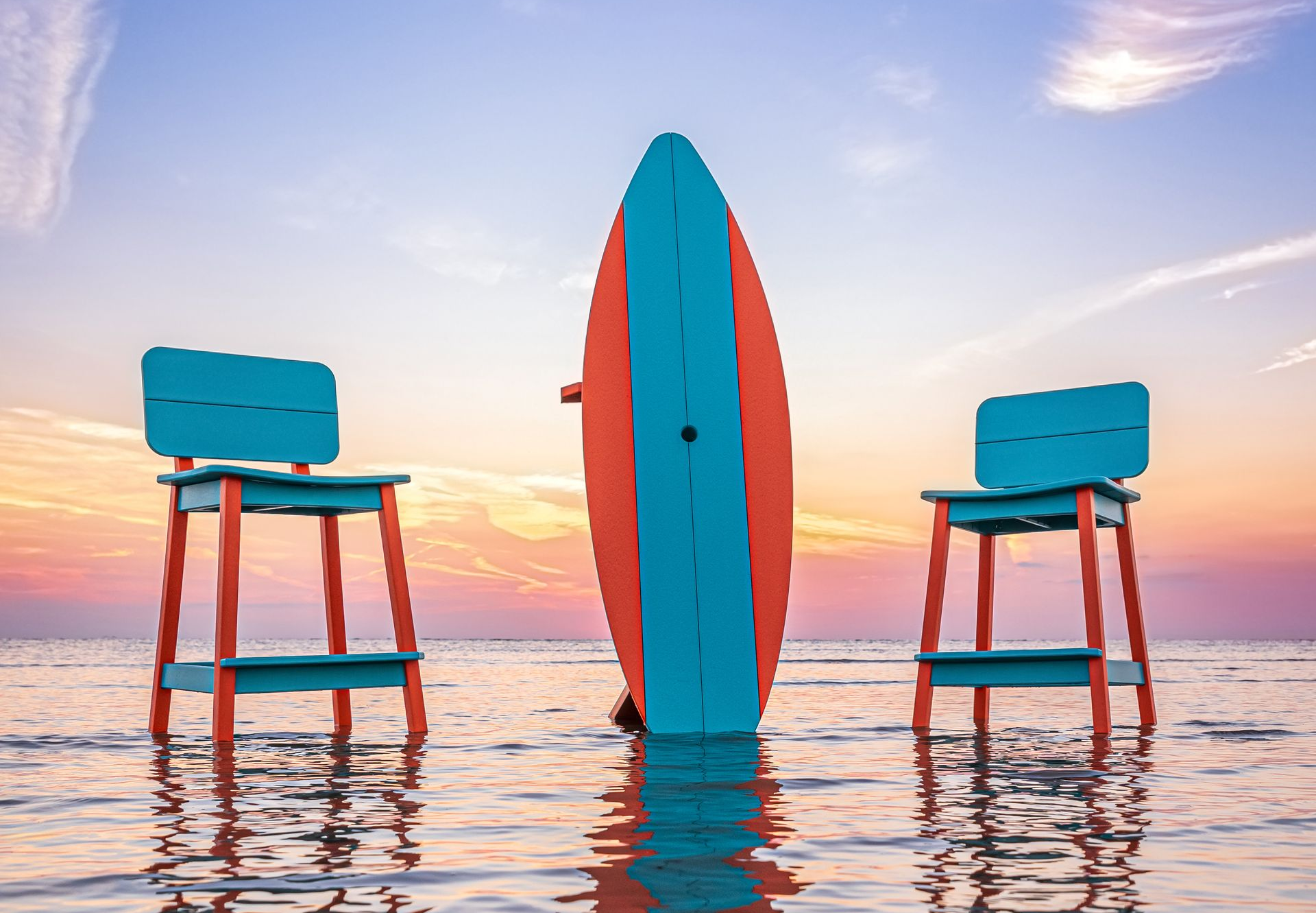 A wooden rocking chair is sitting on a patio next to a fire pit.