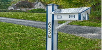 Yard Decor Such As a Wooden Mailbox and Windmills Makes a Statement