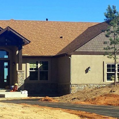 A house with a roof that has shingles on it