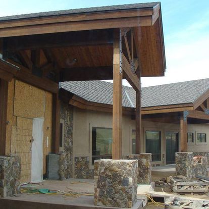 A house under construction with a wooden roof