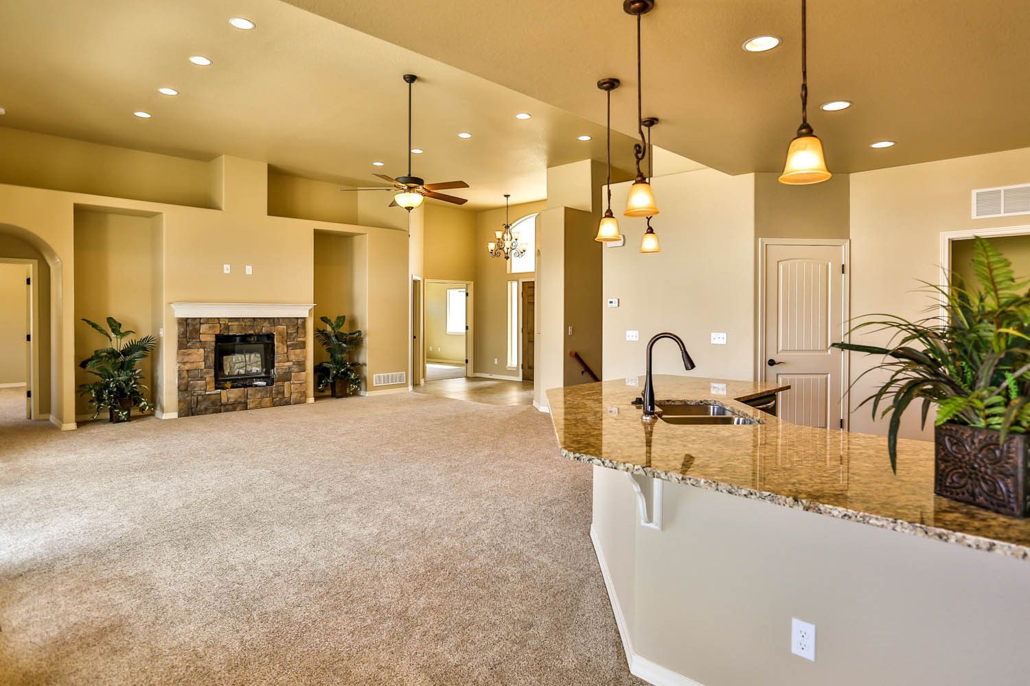 There is a fireplace in the middle of the living room.