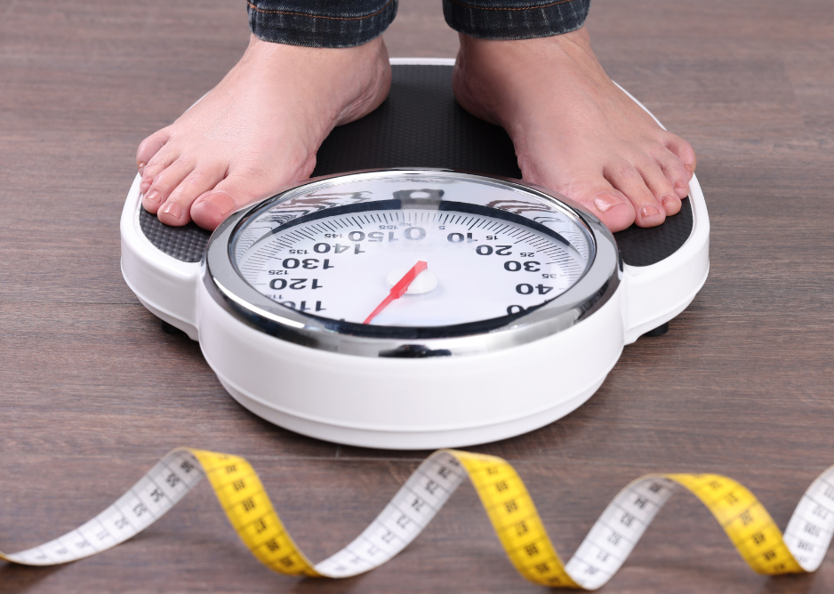 Person Standing On Weighing Scale — Plano, TX — North Texas Medical Anti-Aging Center