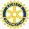 A yellow and blue rotary international logo on a white background.