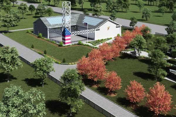 An aerial view of a building with an american flag on top of it