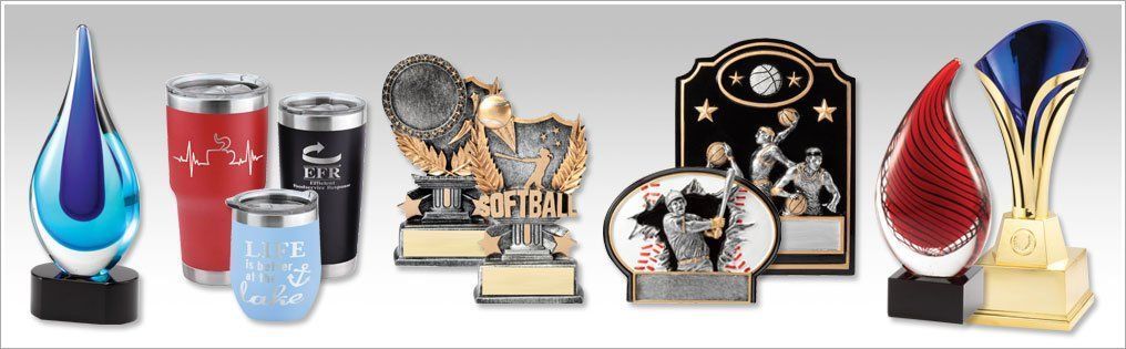 A variety of trophies are lined up in a row — Riverside, CA  — Awesome Awards Western Trophy