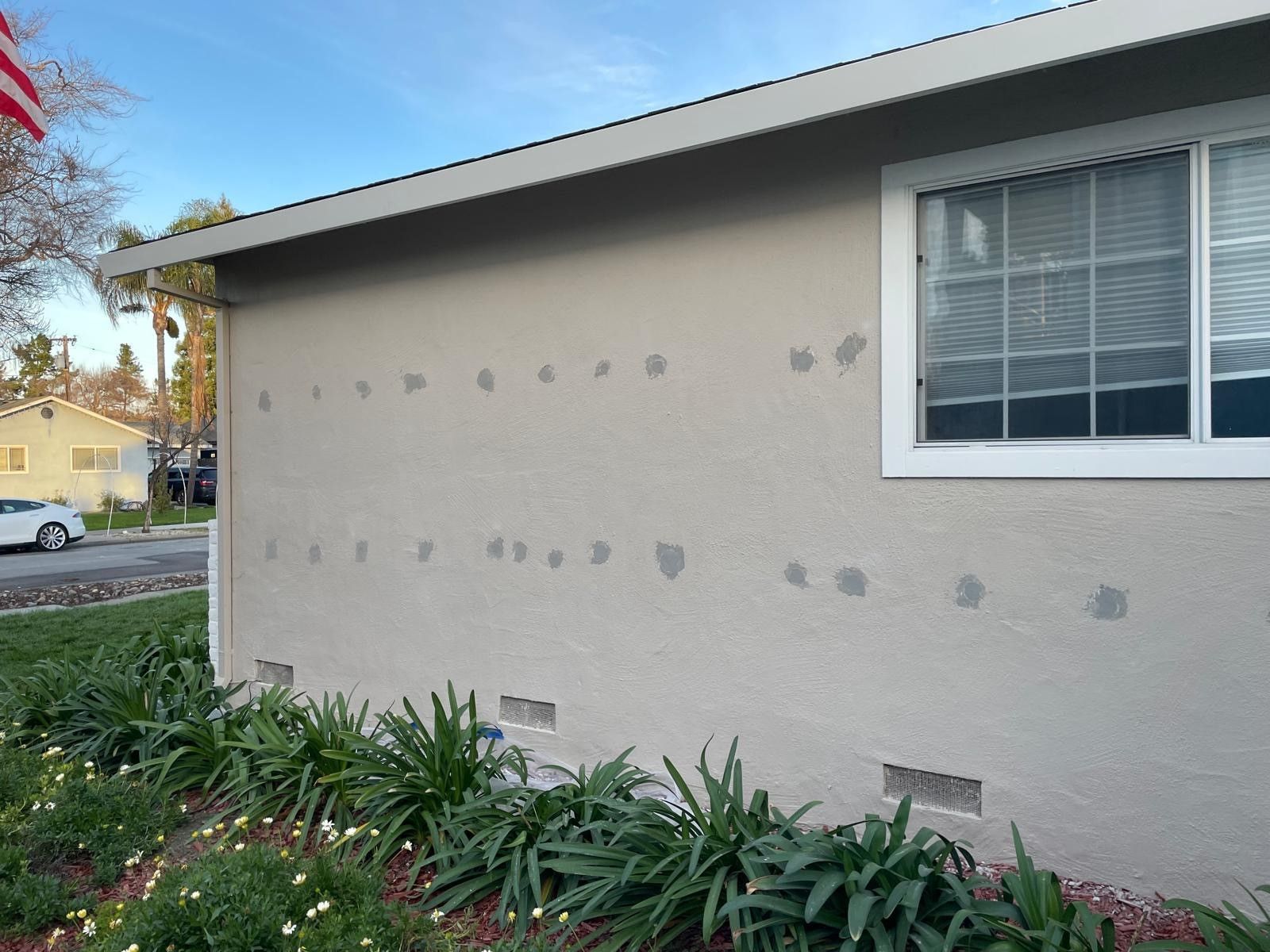 A close up of a white blanket with a quilted pattern.