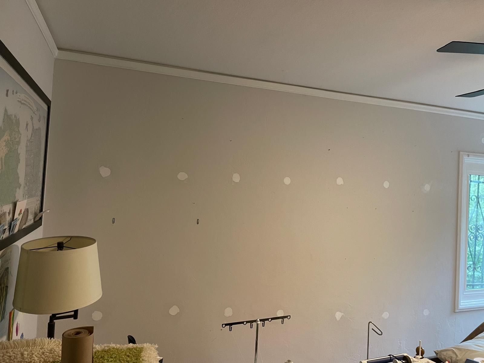 A living room with a lamp and a ceiling fan