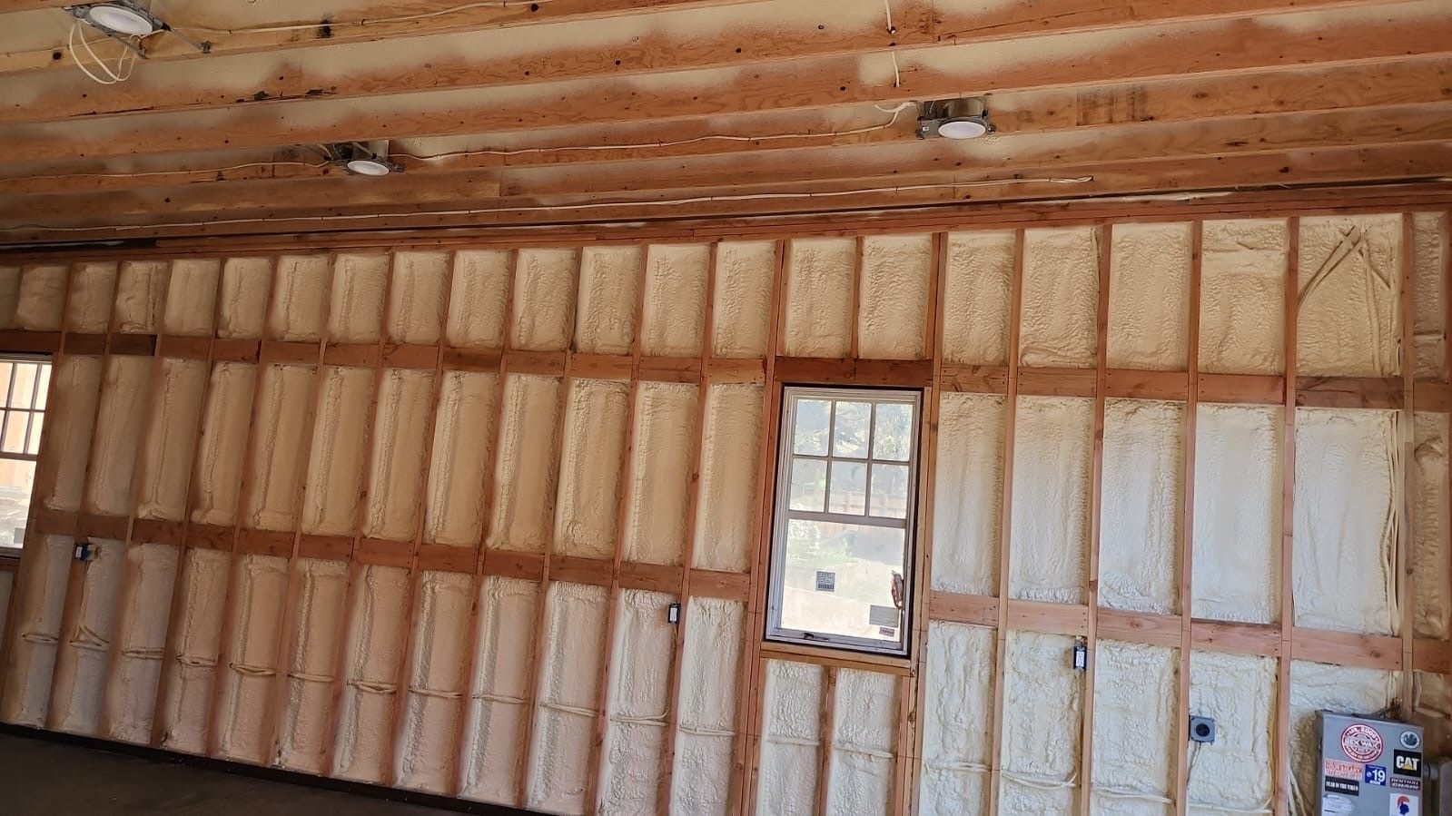 A room with a lot of foam on the walls and a window.