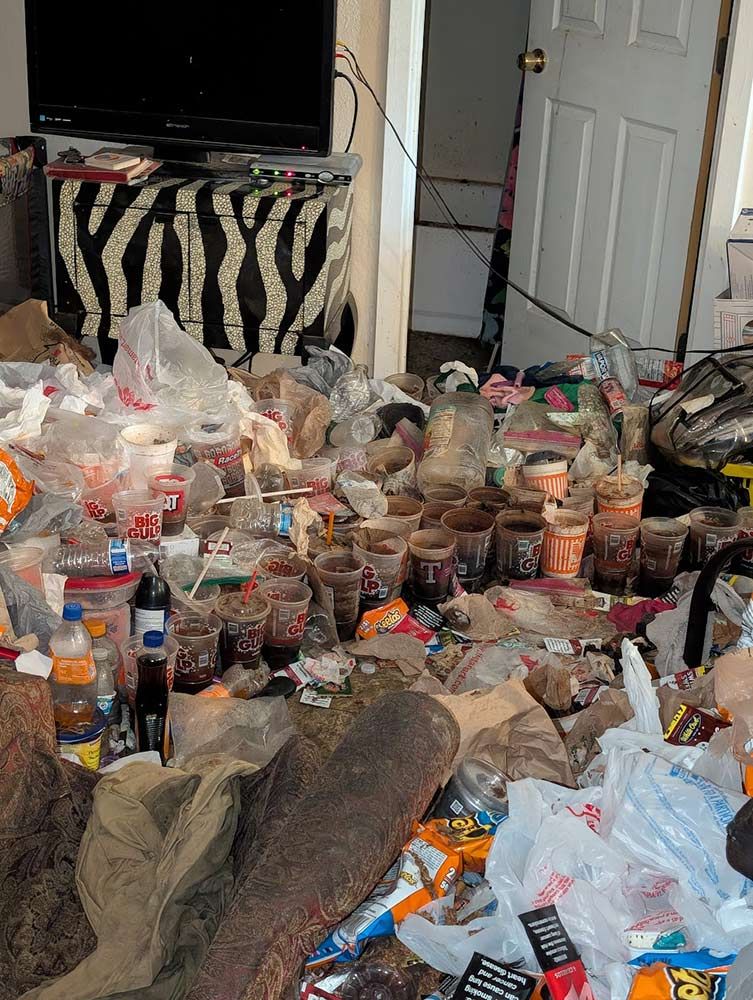 Messy room with trash covering the floor