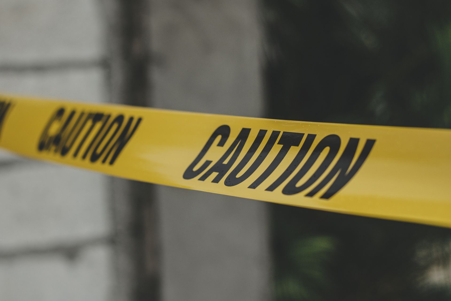 A close up of a yellow caution tape.