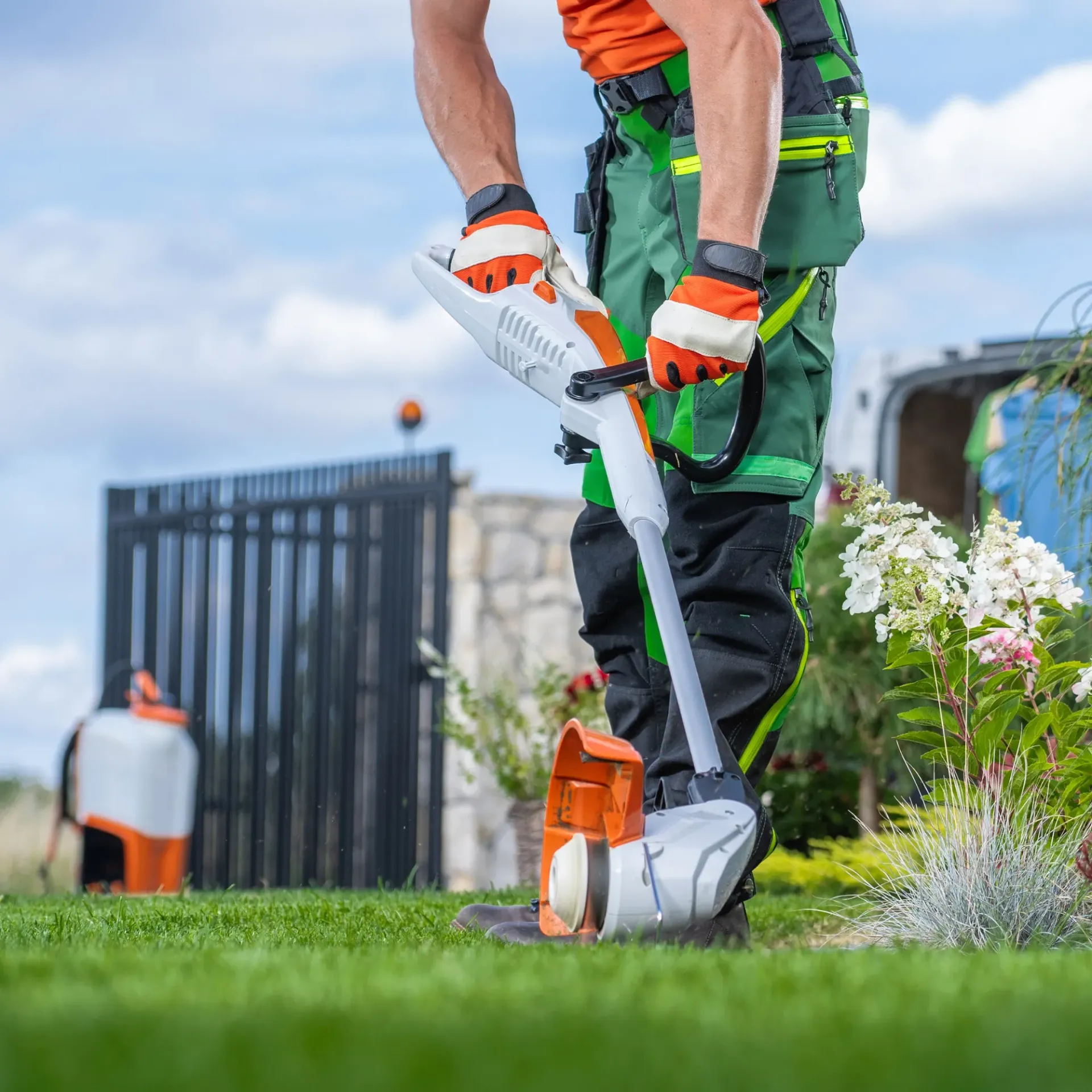 Brothers Landscaping - A man is using a lawn mower to cut the grass.