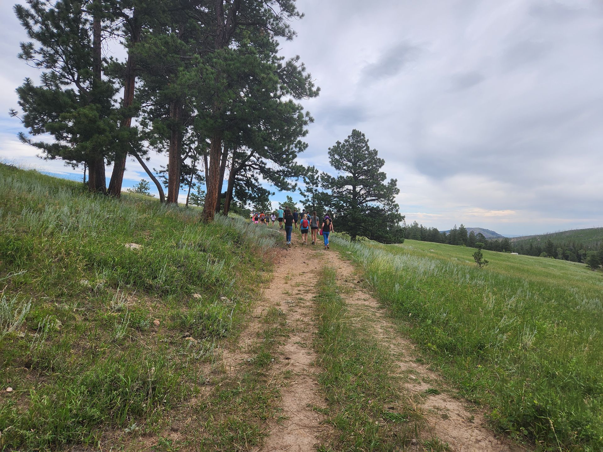 View of distant hikers on trail.