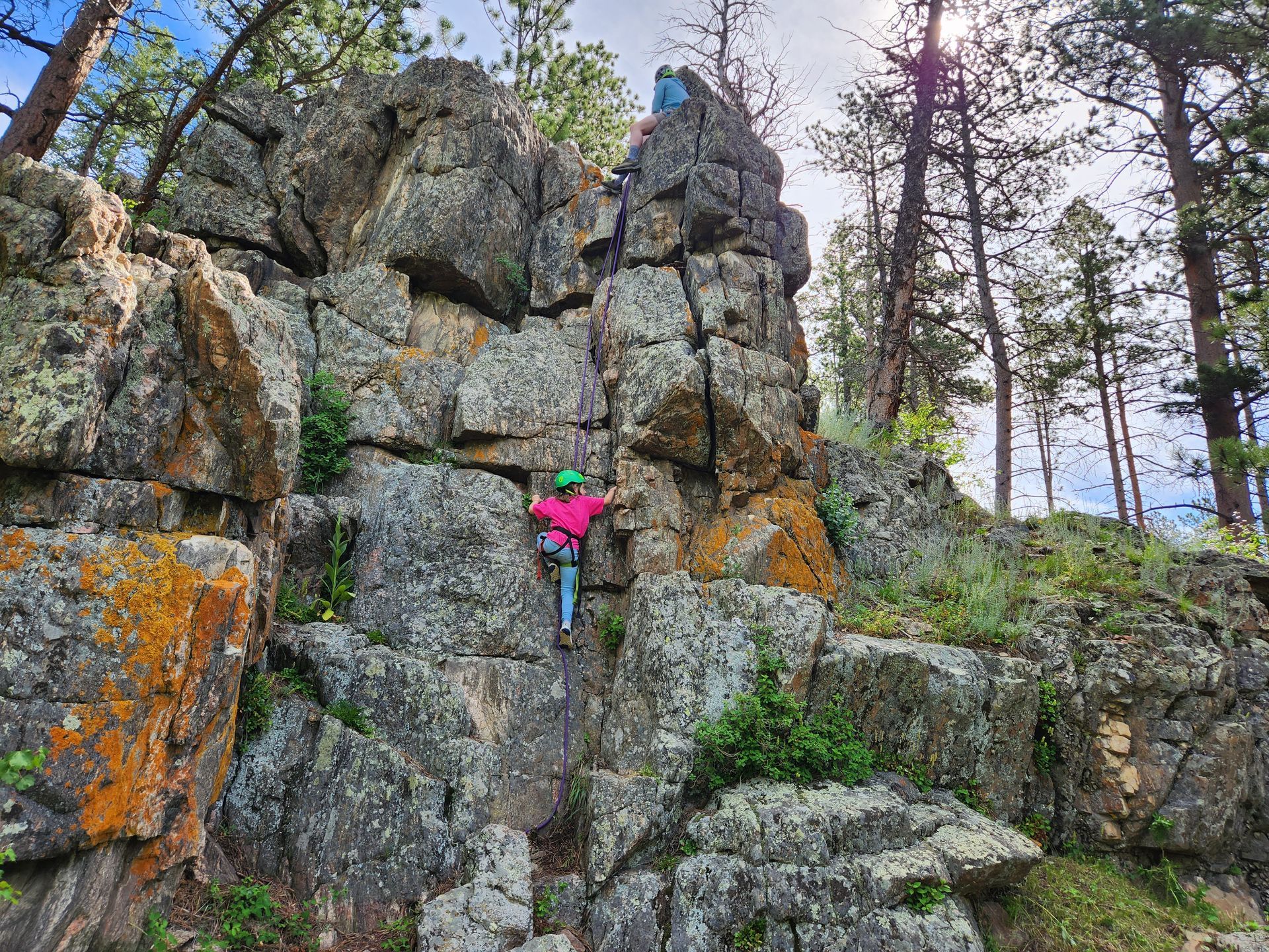 Camper rock climbing