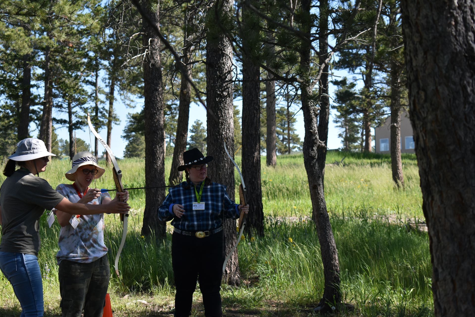 Camp Hope campers shooting arrows in archery.