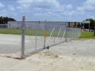 Chain link fence with a rolling gate