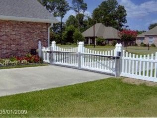 White picket fence with automated gate 