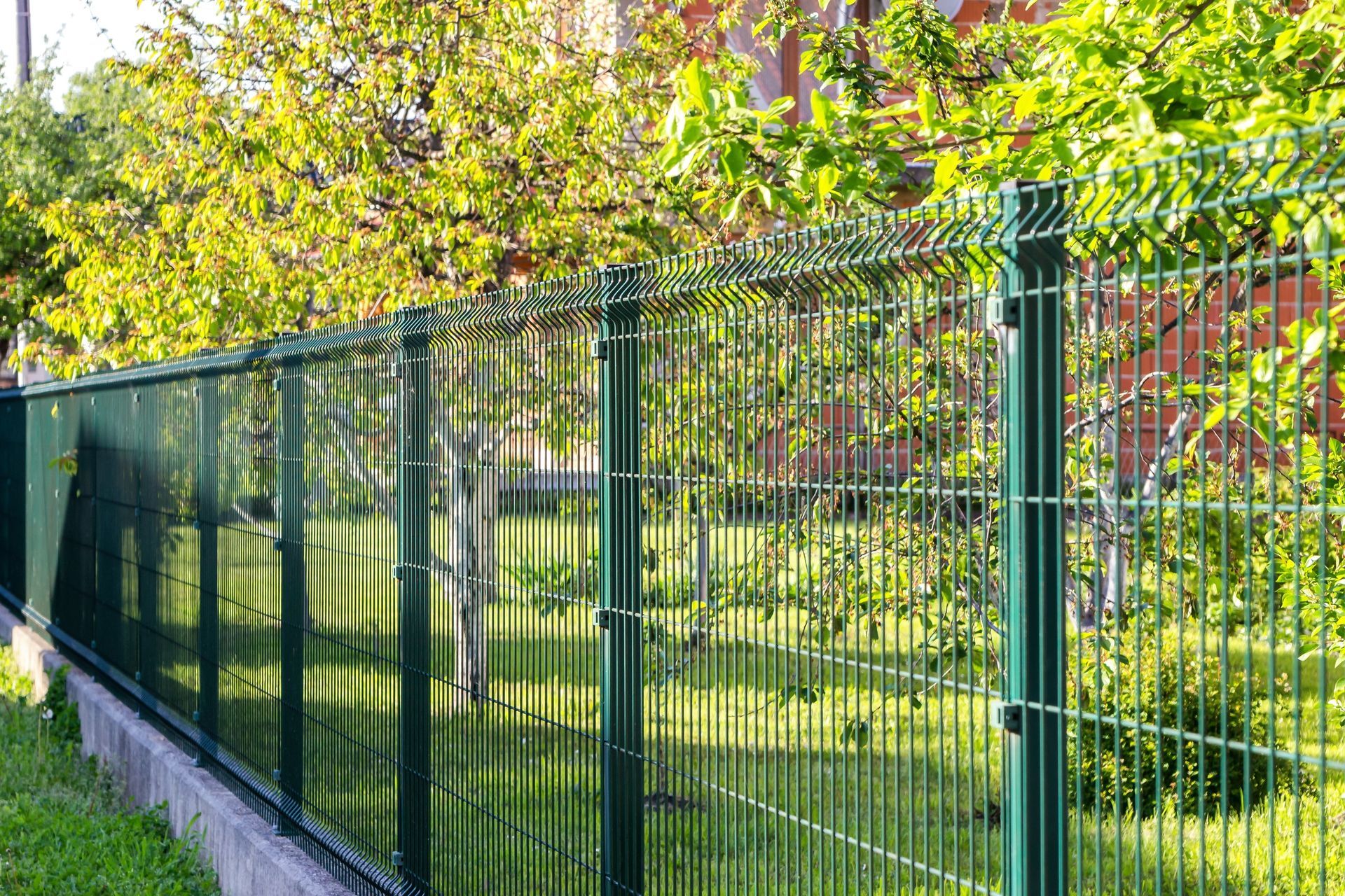 Green wire mesh fence with green posts