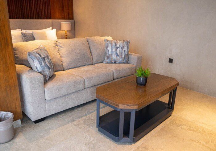 A living room with a couch and a coffee table.