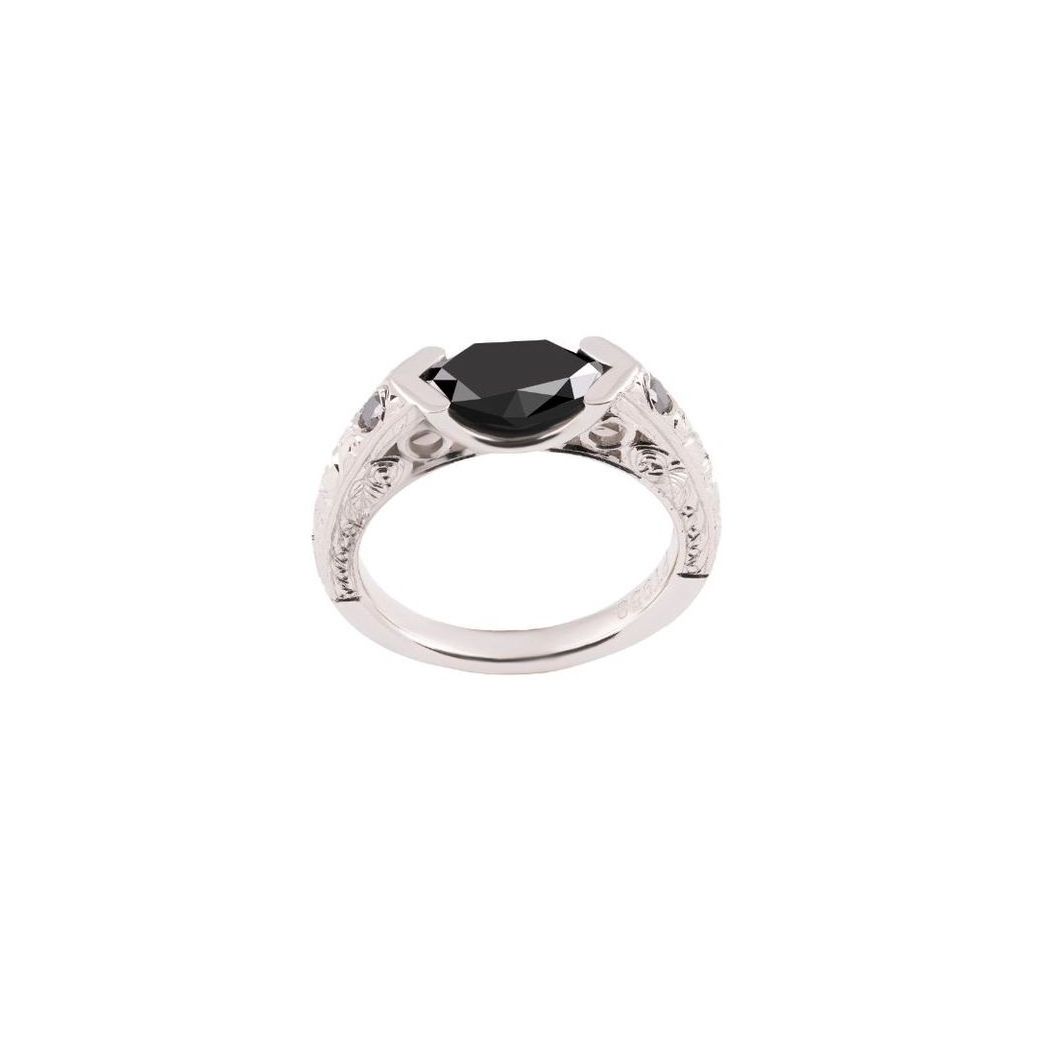 A silver ring with a black stone in the center