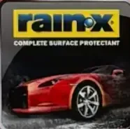 Rain-X product packaging with a red sports car, the brand name, and "Complete Surface Protectant."