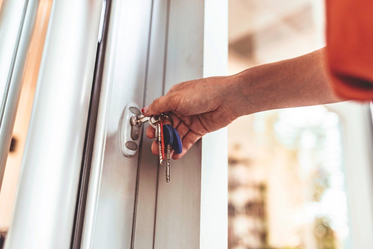 Unlocking store door with a key — Chicago, IL — Ace Lock & Key Smith