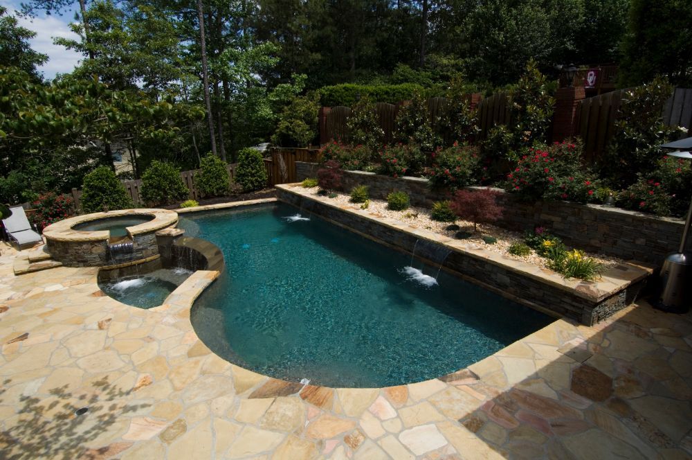 Inground swimming pool and spa with negative edge air shot