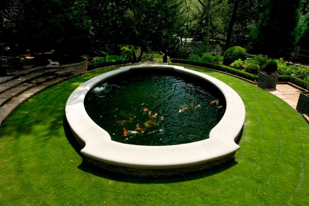 Inground Koi pond with limestone coping