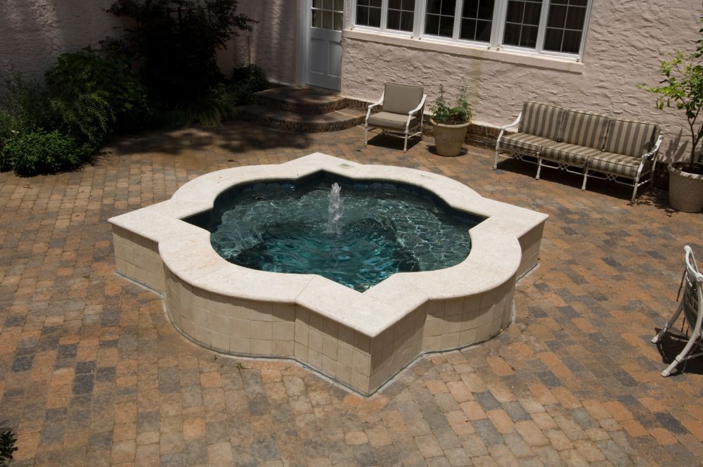 Inground Spa with limestone coping