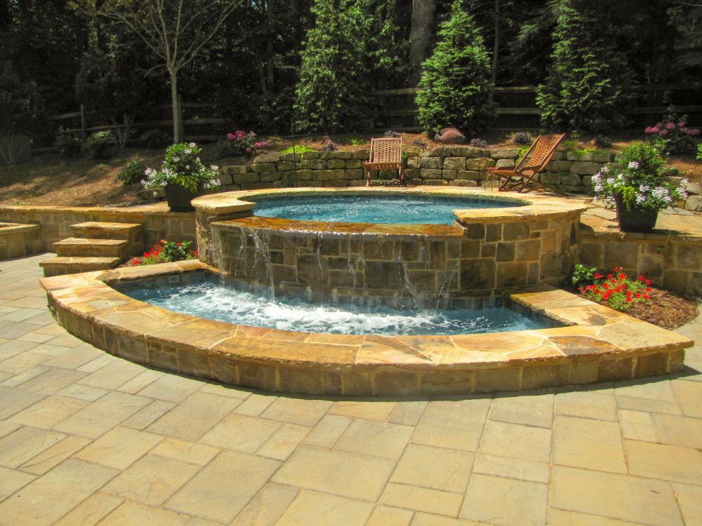 Inground Spa with negative edge and paver deck