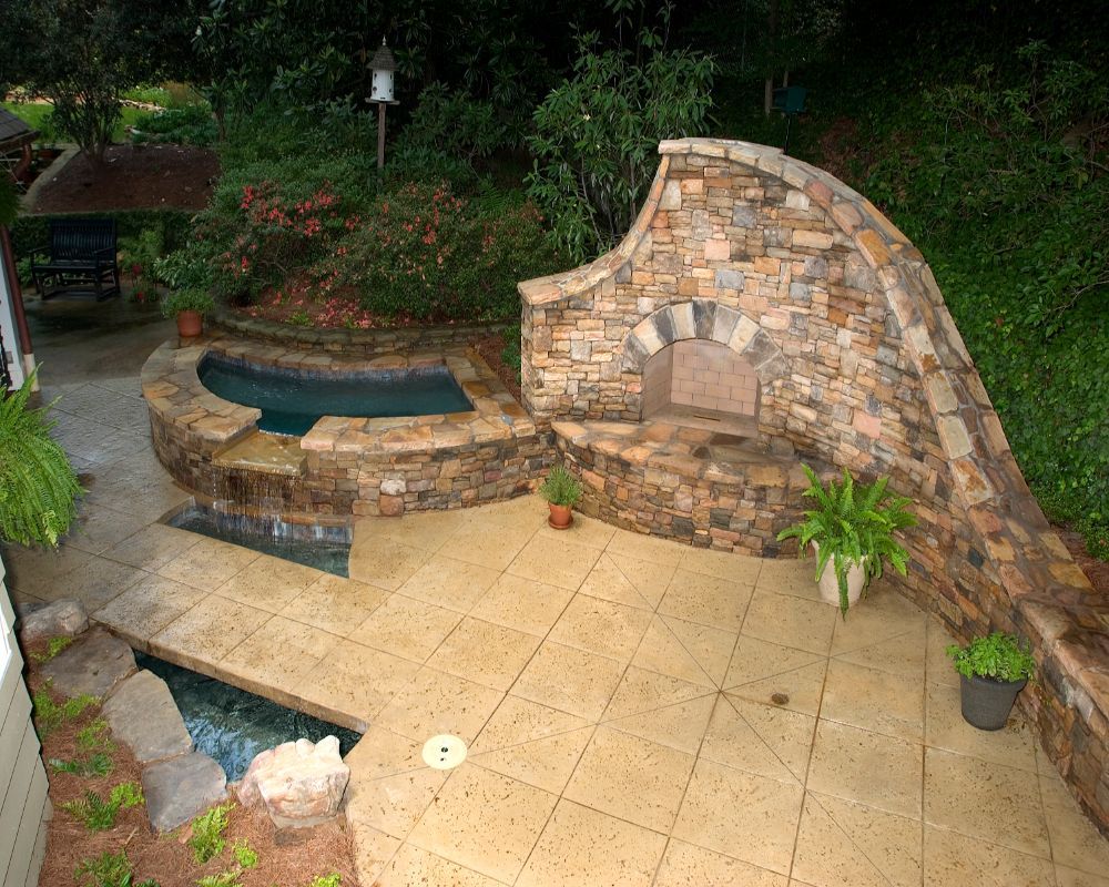 Inground Spa with stacked stone fireplace