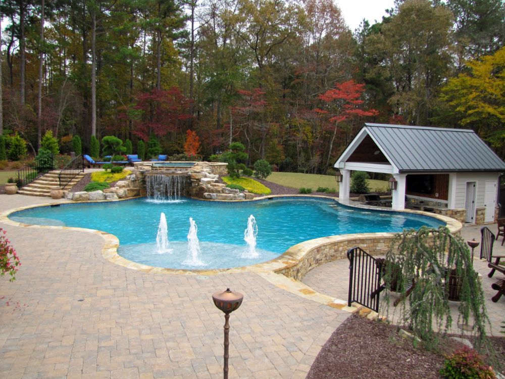 Inground Swimming Pool with grotto and pool house