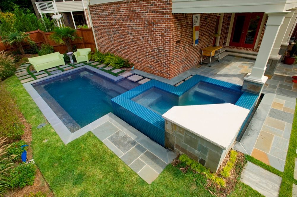 Inground swimming pool and glass tiled spa