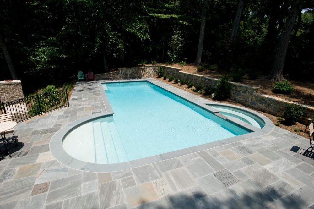 Inground swimming pool and spa with bluestone deck