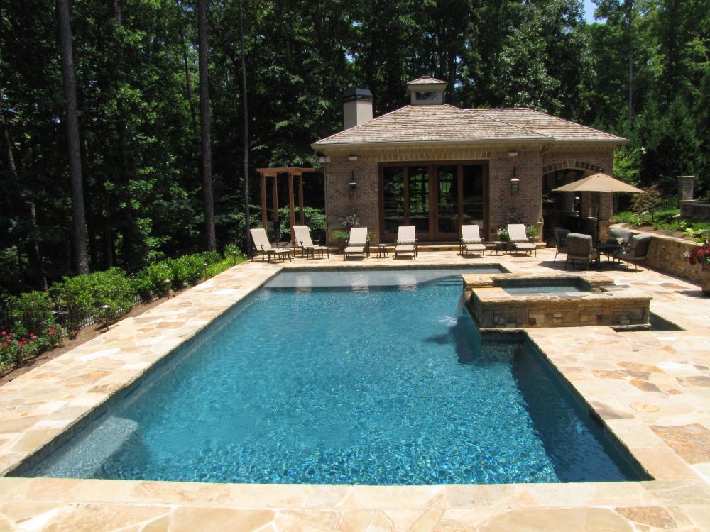 Inground swimming pool and spa with pool house