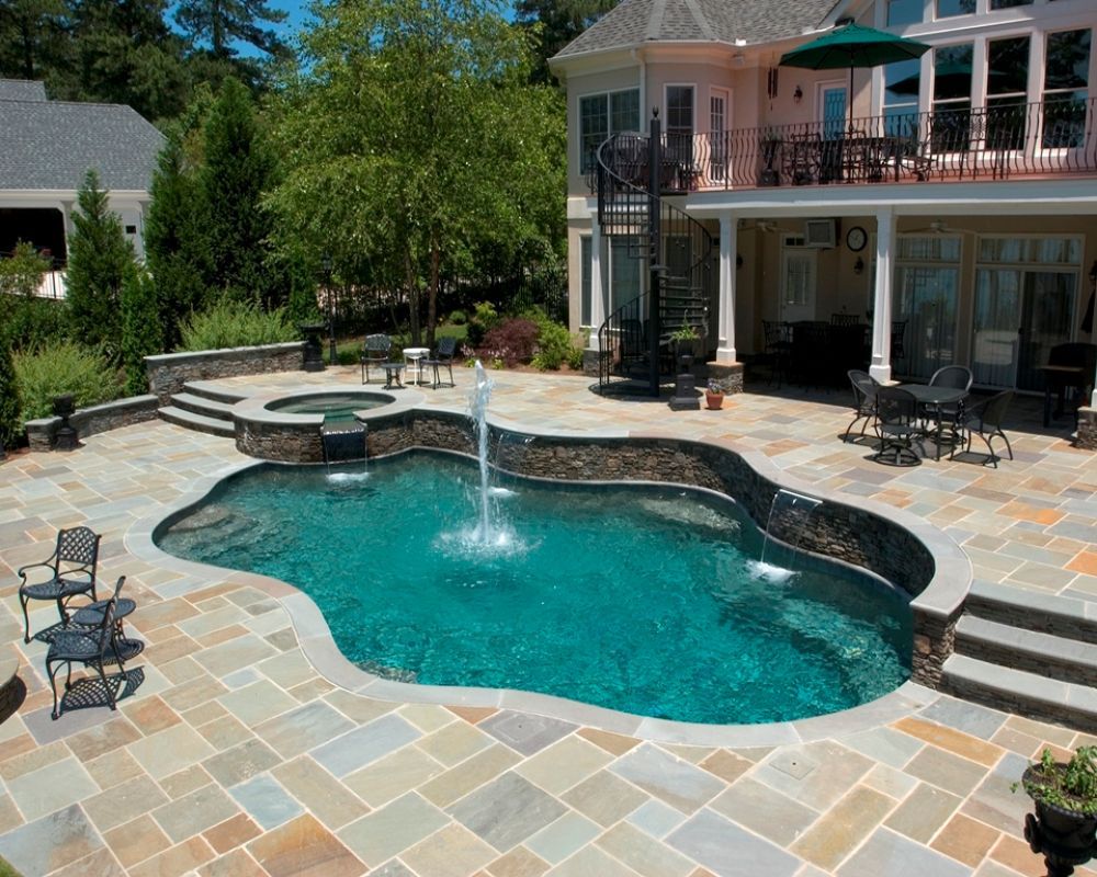 Inground swimming pool with bluestone coping and decking