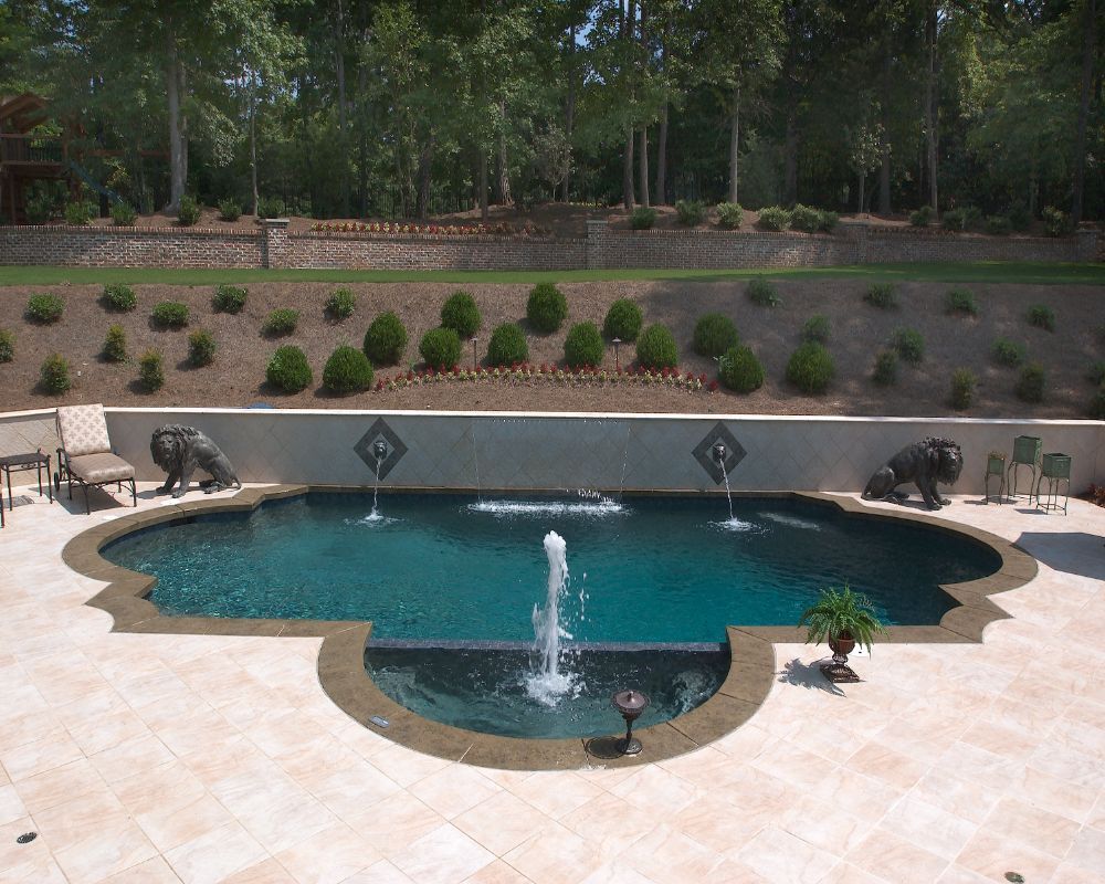 Inground swimming pool with flush spa with fountains
