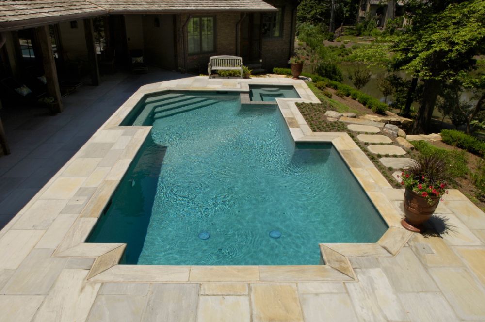 Inground swimming pool with yorkstone deck